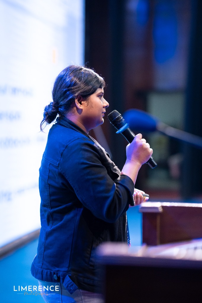 Samia Ahmed — Fractional CMO & Brand Strategist speaking on stage